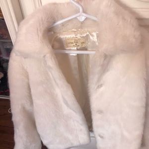 Girls white faux fur coat.